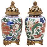 A PAIR OF WUCAI BRONZE MOUNTED VASES PORCELAIN TRANSITIONAL PERIOD, 17TH CENTURY decorated with