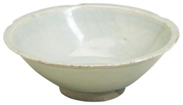 A SMALL 'LONGQUAN' CELADON-GLAZED DISH SOUTHERN SONG DYNASTY (1127-1279) 南宋 青白花口盏 covered in a