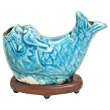 A TURQUOISE-GLAZED WATER DROPPER KANGXI (1662-1722) in the form of a 'dragon-fish', on a hardwood