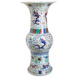 A MASSIVE WUCAI VASE, GU  19TH / 20TH CENTURY  painted with blue and red dragons, and also