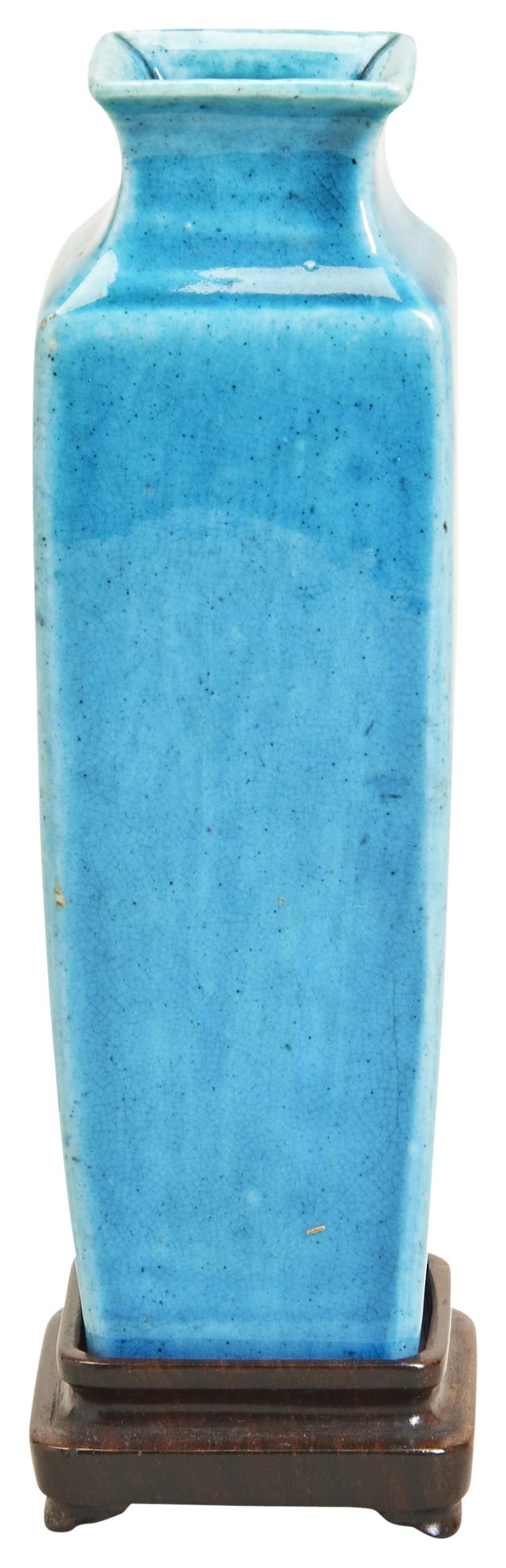 A TURQUOISE-GLAZED SQUARE VASE QING DYNASTY, 18TH CENTURY 清 孔雀绿釉方型瓶 raised on a hardwood stand,