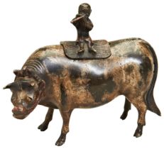 A CHINESE BRONZE CENSER AND COVER 17TH CENTURY in the form of a boy sitting atop an ox, later