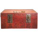 A LARGE CHINESE RED LEATHER TRUNK  QING DYNASTY, 19TH CENTURY the sides with relief decoration of