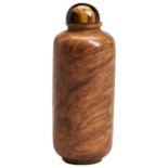 A WOODEN SNUFF BOTTLE WITH A STOPPER  19TH/20TH CENTURY natural grain of the wood with a tiger eye