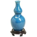 A SMALL TURQUOISE-GLAZED DOUBLE GOURD VASE QING DYNASTY, 18TH CENTURY with a hardwood stand, in a