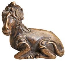 A FINE BRONZE QILIN-FORM SCROLL WEIGHT MING DYNASTY, 16TH / 17TH CENTURY the recumbent beast