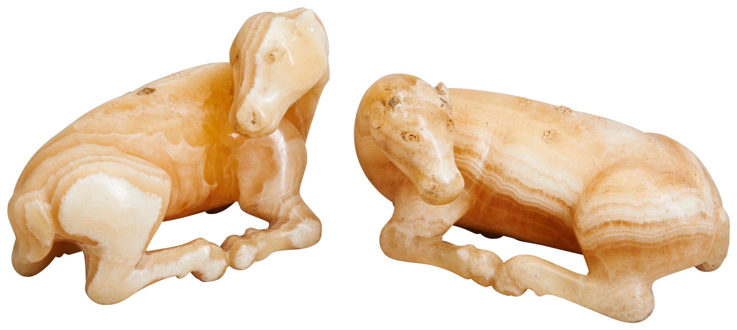 A RARE PAIR OF SOAPSTONE FIGURES OF DEER QING DYNASTY, 19TH CENTURY 清 寿山石鹿型摆件一对 the deer modelled