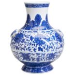 A MING-STYLE BLUE & WHITE 'LOTUS' VASE QING DYNASTY, 19TH CENTURY of compressed Hu-form, the sides