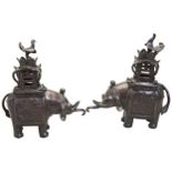 A PAIR OF BRONZE ELEPHANT INCENSE BURNERS LATE QING DYNASTY the caparisoned beast standing four