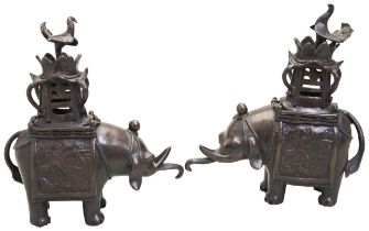 A PAIR OF BRONZE ELEPHANT INCENSE BURNERS LATE QING DYNASTY the caparisoned beast standing four