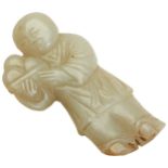 A SMALL CARVED JADE FIGURE OF A BOY 18TH CENTURY modelled as the boy holding three peaches 6cm high