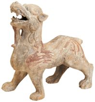 A LARGE PAINTED POTTERY FIGURE OF A MYTHICAL BEAST EASTERN HAN DYNASTY (AD.25-220) modelled as a