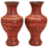 A PAIR OF CINNABAR LACQUER VASES LATE QING DYNASTY carved with scholars and attendants in mountain