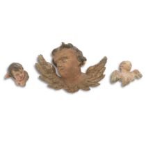 Three Continental Polychromed Angel Heads with Wings