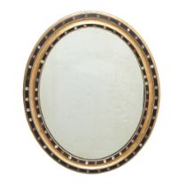 Irish Victorian 'Jewel'-Mounted Part-Silvered and -Ebonized Oval Mirror