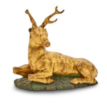 Continental Painted and Parcel-Gilt Carved Wood Figure of a Recumbent Stag