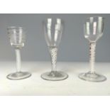 Three English late 18th century double-series opaque twist wine glasses, one with an etched bowl, ea
