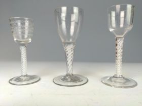 Three English late 18th century double-series opaque twist wine glasses, one with an etched bowl, ea