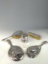 Silver mounted hand mirror and two silver topped glass vanity jars with embossed Reynold's angels, t