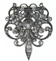 White metal and diamond clip / brooch. Old European cut diamonds in milgrain and pave settings on wh