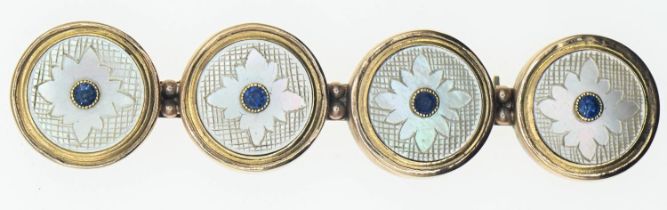 Brooch comprising of four 18ct gold, mother-of-pearl and sapphire set buttons mounted onto a 9ct gol