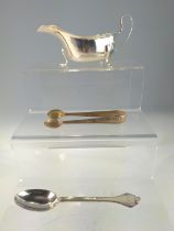 George V silver sauce boat, Viner's Ltd, Sheffield 1934, length 14.5cm, together with a George V sil