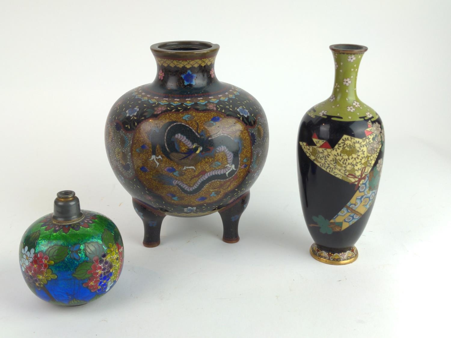 Three Japanese cloisonné vessels inc. a tripod koro decorated with panels of flora, butterflies and 