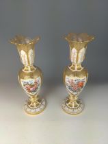 Pair of Bohemian painted and white overlay glass vases, each painted with a gentleman or a lady, wit