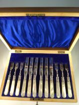 Cased set of six silver and mother-of-pearl dessert knives and forks, blades and prongs hallmarked W