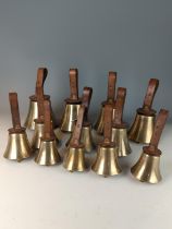 Set of twelve brass leather handled campanology hand bells, leather handles stamped F.R. Barnett and