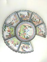 A set of C18th Chinese enamel sweetmeat or rice serving dishes painted with figures in a landscape a