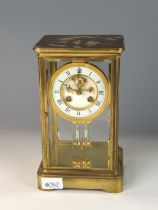 French brass and glass sided mantle clock with mercury pendulum. Stamped 324. W 15.5cm x D 13.5cm x