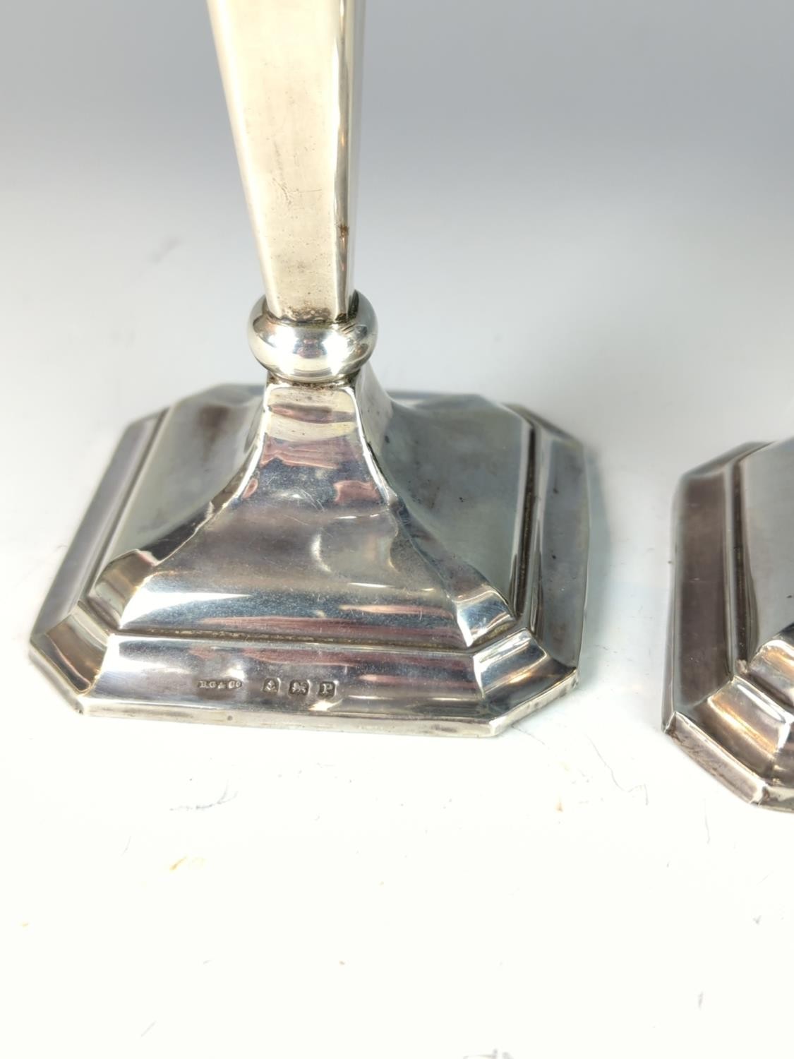 Pair of silver candlesticks, Britton, Gould & Co, Birmingham 1939, each with urn-shaped nozzles, tap - Image 2 of 3