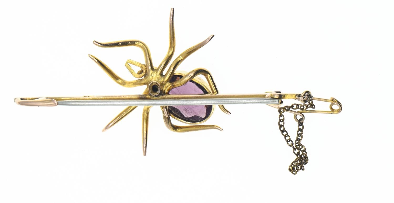 9ct gold mounted spider bar brooch. Body set with a purple paste stone and seed pearl. Gross weight  - Image 2 of 3