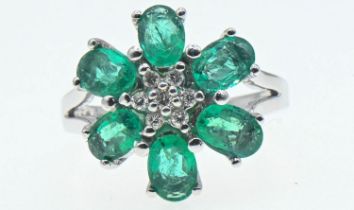 18ct white gold, emerald and diamond flowerhead cluster ring, size O, gross weight 6 grams