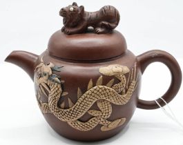 Yixing tea pot with dragon and marks to base. H10.5cm