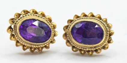 Pair of 9ct gold earrings set with amethysts. Gross weight 1.69g