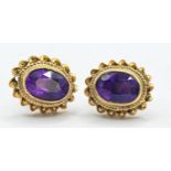 Pair of 9ct gold earrings set with amethysts. Gross weight 1.69g 