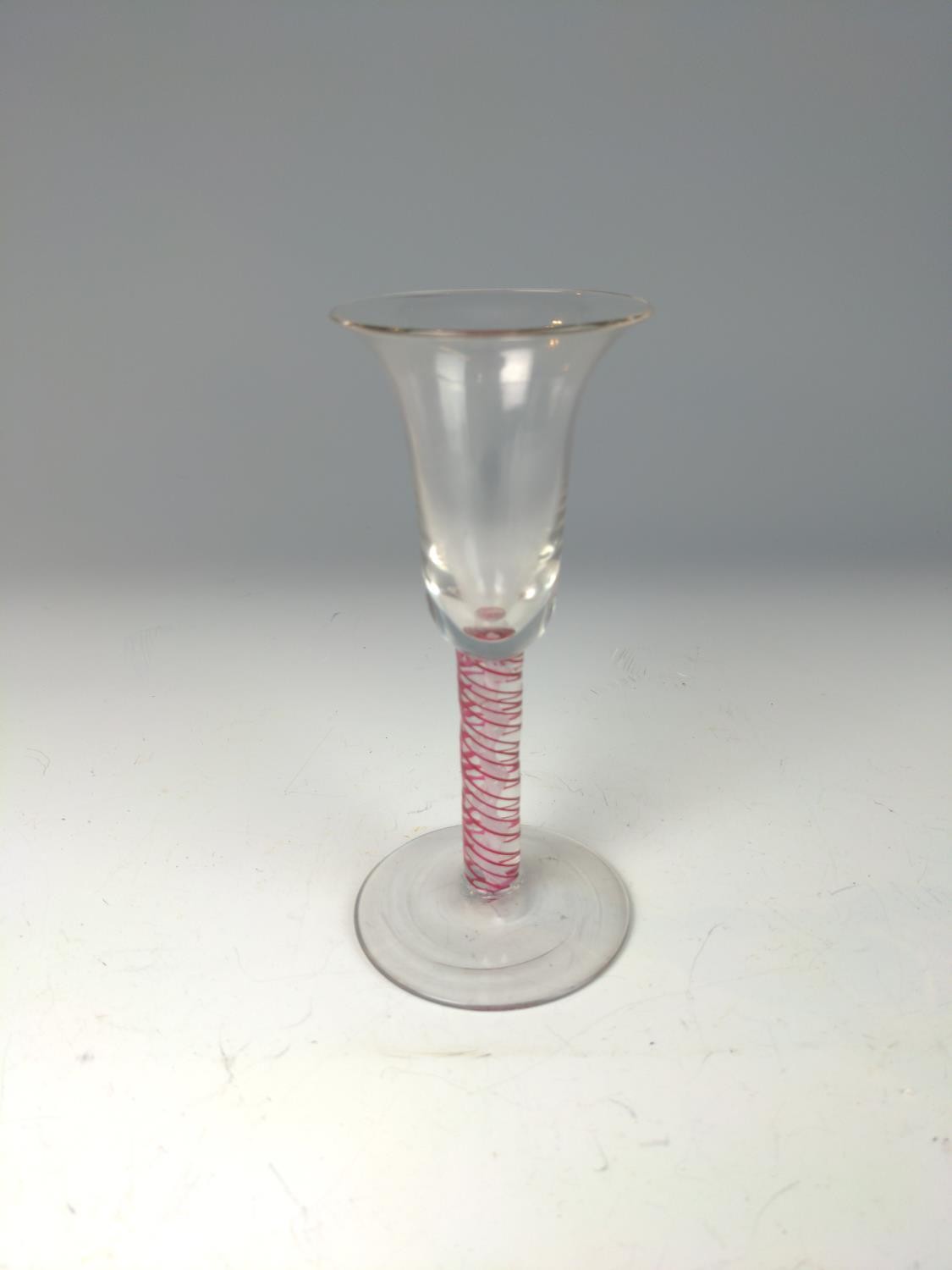 Opaque and red twist stem wine glass, probably Dutch, with bell-shaped bowl, on a conical foot, heig