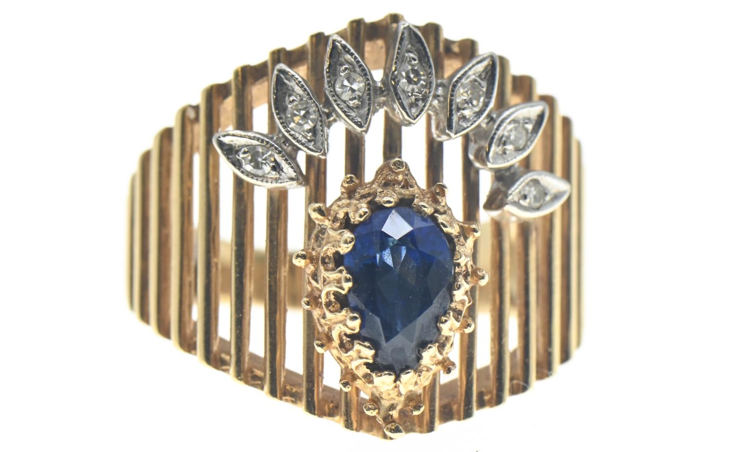 14ct gold ring (marked 14 but rubbed) set with pear shaped sapphire and a fan of small white sapphir