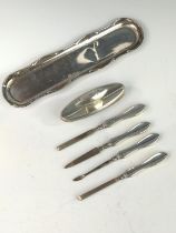 Edwardian five piece silver handled manicure set, William Devenport, Birmingham 1905, together with