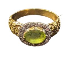 Peridot and diamond cluster ring, stone set in white metal and mounted on 18ct gold with floral reli