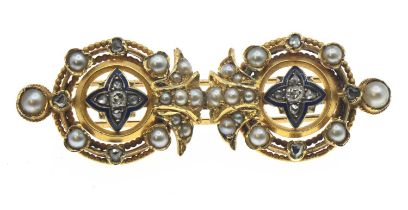 Yellow metal Etruscan revival brooch set with old cut diamonds and diamond chips. With split seed pe