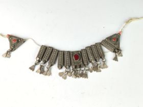 Yemeni or Bedouin white metal collar (loose on string) set with red glass .