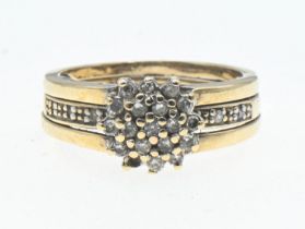 9ct gold and diamond cluster ring with split shoulder design, size J 1/2, gross weight 3.80g.