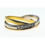 Tricoloured yellow metal crossover ring set with diamonds. Size O, gross weight 3.49g 