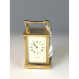 Garrard & Co. brass carriage clock with bevelled glass sides. W 8cm x D 6cm x H 15cm. 