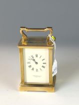 Garrard & Co. brass carriage clock with bevelled glass sides. W 8cm x D 6cm x H 15cm. 