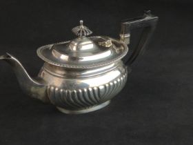 George V silver teapot, Jenkins & Timms, Sheffield 1922, with half reeded lower body, ebonised handl