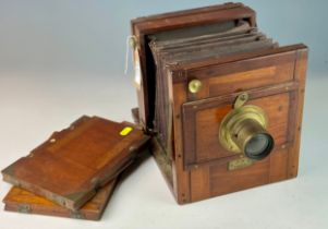 Wood encased plate camera dating to 1884 with brass f9 4.5mm lens and other brass furniture with two